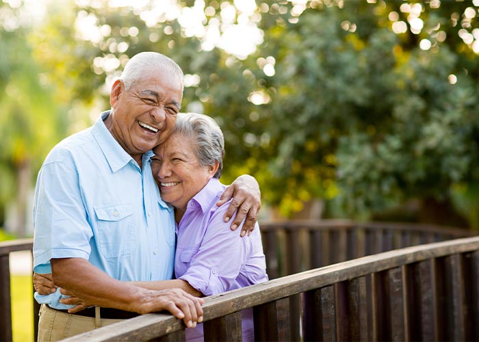 Image of a couple hugging and laughing.